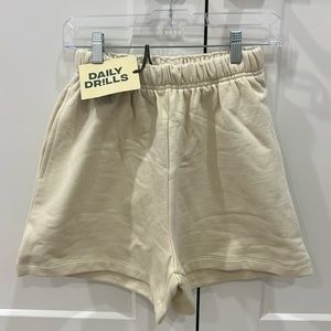 daily drills sweat shorts. size xs/s in the color sand.